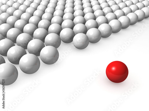 One unique red ball among other white