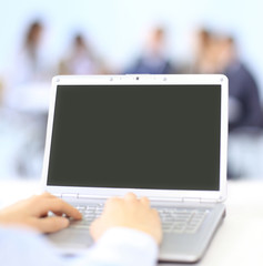 Wall Mural - Person Typing on a modern laptop in an office