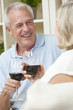 © Darren Baker - Happy Senior Man & Woman Couple Drinking Wine at Home