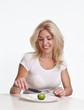 © Denizo - Diet concept. Woman sitting in front of an empty dish.
