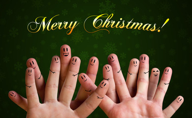 Merry christmas happy finger group with smiley faces on green ba