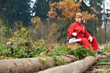 Canvas Print - Lumberjack Worker With Chainsaw In The Forest