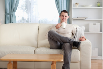 Aufkleber - Man having a tea while reading the news
