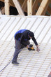 © JPchret - roofer working on a new roof in wood, ouvrier couvreur