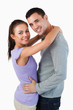 © WavebreakmediaMicro - Smiling young couple embracing