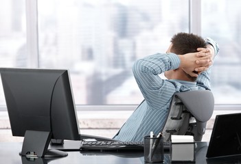 Businessman resting at desk