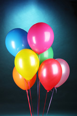 bright balloons on blue background