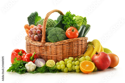 Fototapeta na wymiar Composition with vegetables and fruits in wicker basket isolated