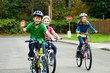 Kids riding bicycles in the street