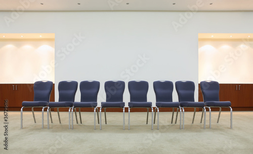 Row Of Comfortable Gray Chairs In Light Waiting Room Buy This