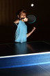 © Pavel Losevsky - little boy wearing blue shirt playing ping pong;