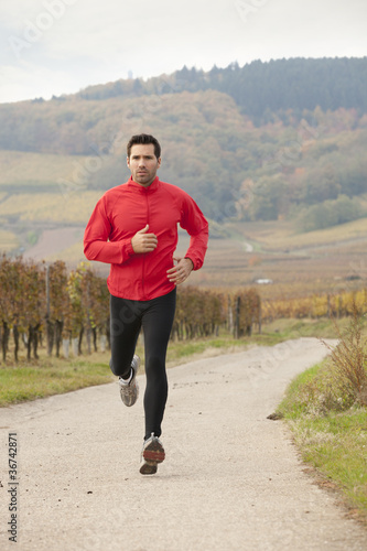 Beau jeune homme fait son jogging en pleine nature - Buy this stock photo  and explore similar images at Adobe Stock | Adobe Stock