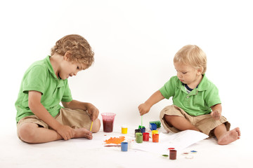 Two boys with paints