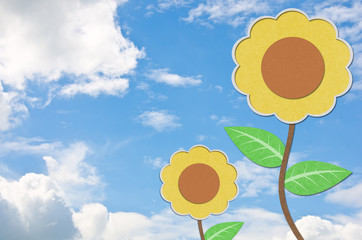 Wall Mural - sunflower recycled paper craft and blue sky.
