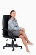 © WavebreakmediaMicro - Portrait of a businesswoman sitting on an armchair