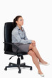 © WavebreakmediaMicro - Portrait of a serious businesswoman sitting on an armchair