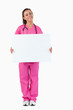 © WavebreakmediaMicro - Portrait of a female doctor holding a blank panel