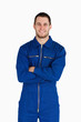 © WavebreakmediaMicro - Smiling mechanic in boiler suit with folded arms