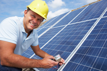 Man installing solar panels