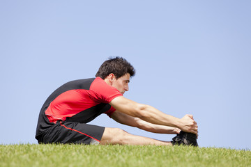 Wall Mural - Athlete warming and stretching