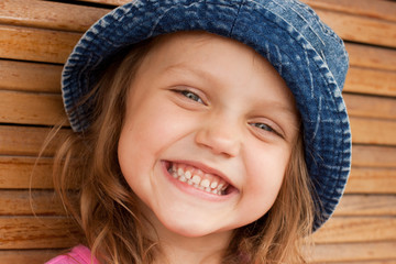 happy kid in jeans hat