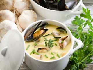 Wall Mural - mussel soup with saffron and cream sauce