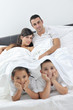 © .shock - happy young Family in their bedroom