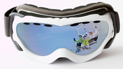 Skiing - reflection of happy skiers on ski lift