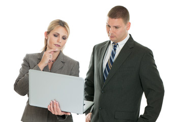 Business people looking at laptop