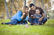 © Andy Dean - Happy Mixed Race Ethnic Family Playing with Bubbles In The Park