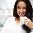 © Milles Studio - Closeup portrait of a pretty young female having a cup of coffee