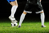 Fototapeta Sport - football players in action for the ball