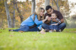 © Andy Dean - Happy Mixed Race Ethnic Family Playing with Bubbles In The Park