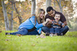 © Andy Dean - Happy Mixed Race Ethnic Family Playing with Bubbles In The Park