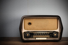 Antique Radio On Vintage Background