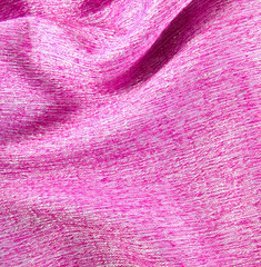 Pink crumpled silk fabric textured background