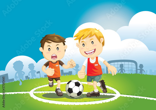 Naklejka ścienna Children playing soccer outdoors