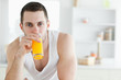 © WavebreakmediaMicro - Good looking man drinking orange juice