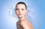 Fototapeta  - Beauty portrait of woman with splashes of water