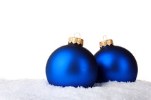 Beautiful Blue Christmas Balls In Snow Isolated On White