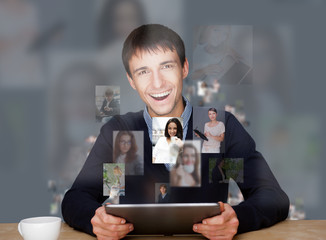 Wall Mural - A businessman working on modern technology tablet computer and c