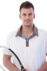 Wall Mural - Portrait of handsome tennis player smiling