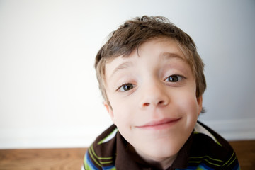 Little boy with silly grin and wide angle distored face