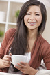 © Darren Baker - Beautiful Chinese Oriental Asian Woman Drinking Tea or Coffee