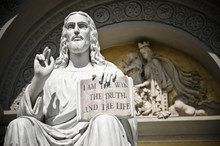 Jesus Statue With The Quote Book