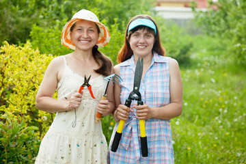 gardeners  working with garden tools