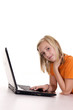 © aletia2011 - young girl lying with laptop