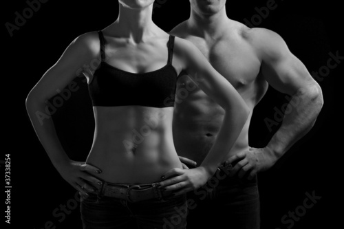 Fototapeta na wymiar man and a woman in the gym