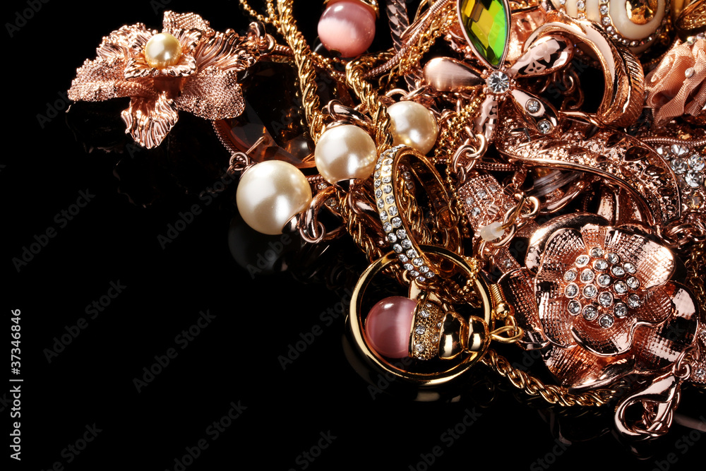 Various gold jewellery on black