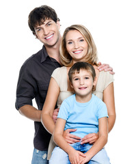 Wall Mural - Happy young family with  child - isolated